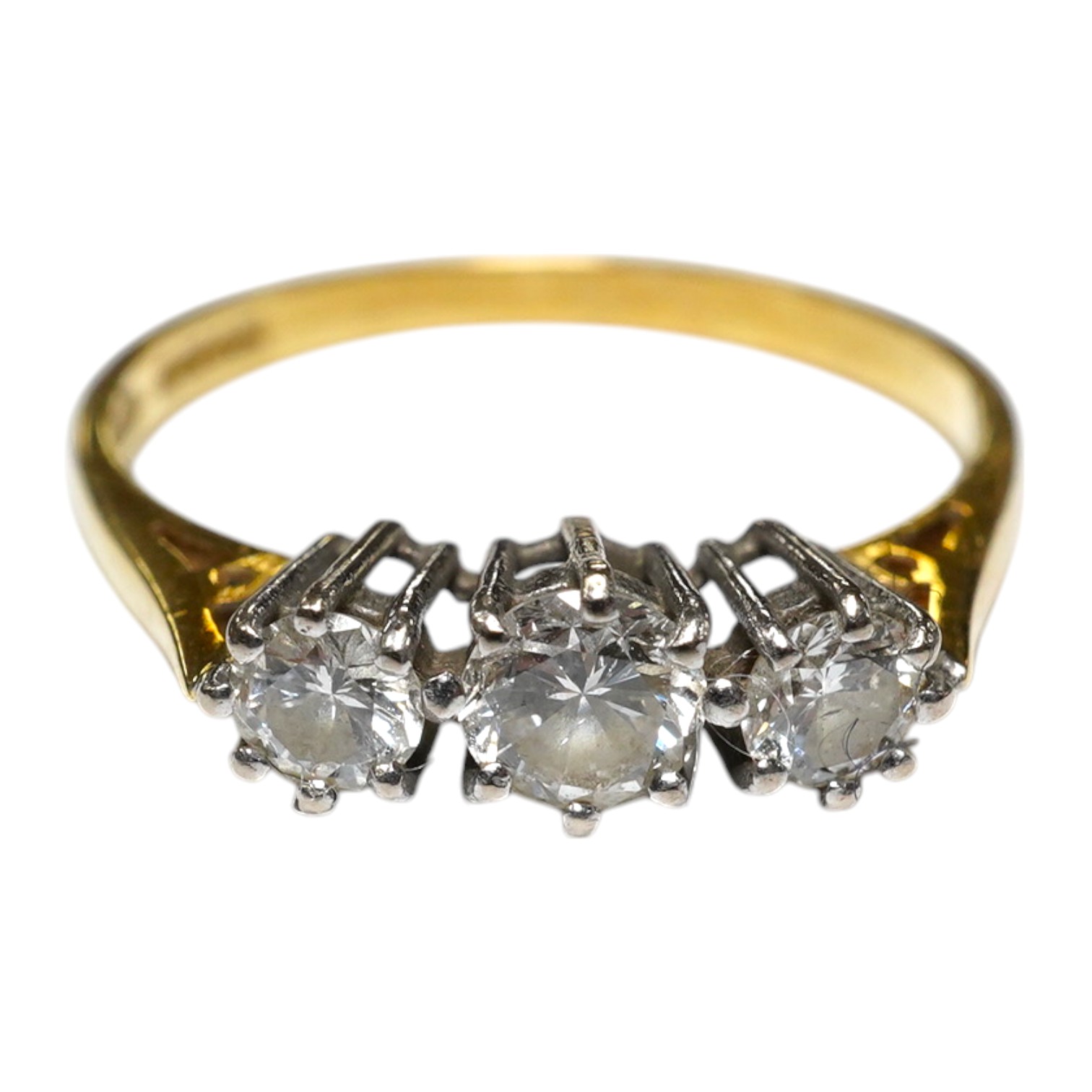 A modern 18ct gold and three stone diamond set ring, size M, gross weight 2.1 grams. Condition - fair to good